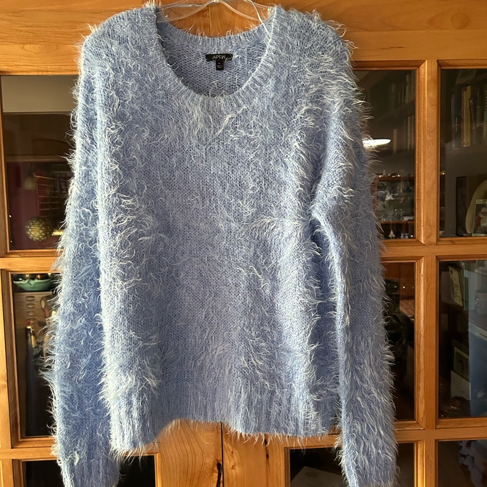 Apt 9 sweater. It also has some sparkle to it as well.